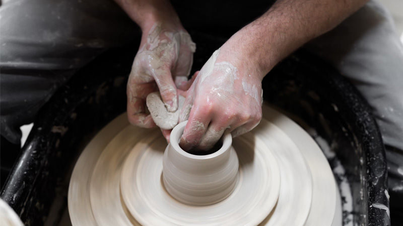 hands working a ceramics wheel