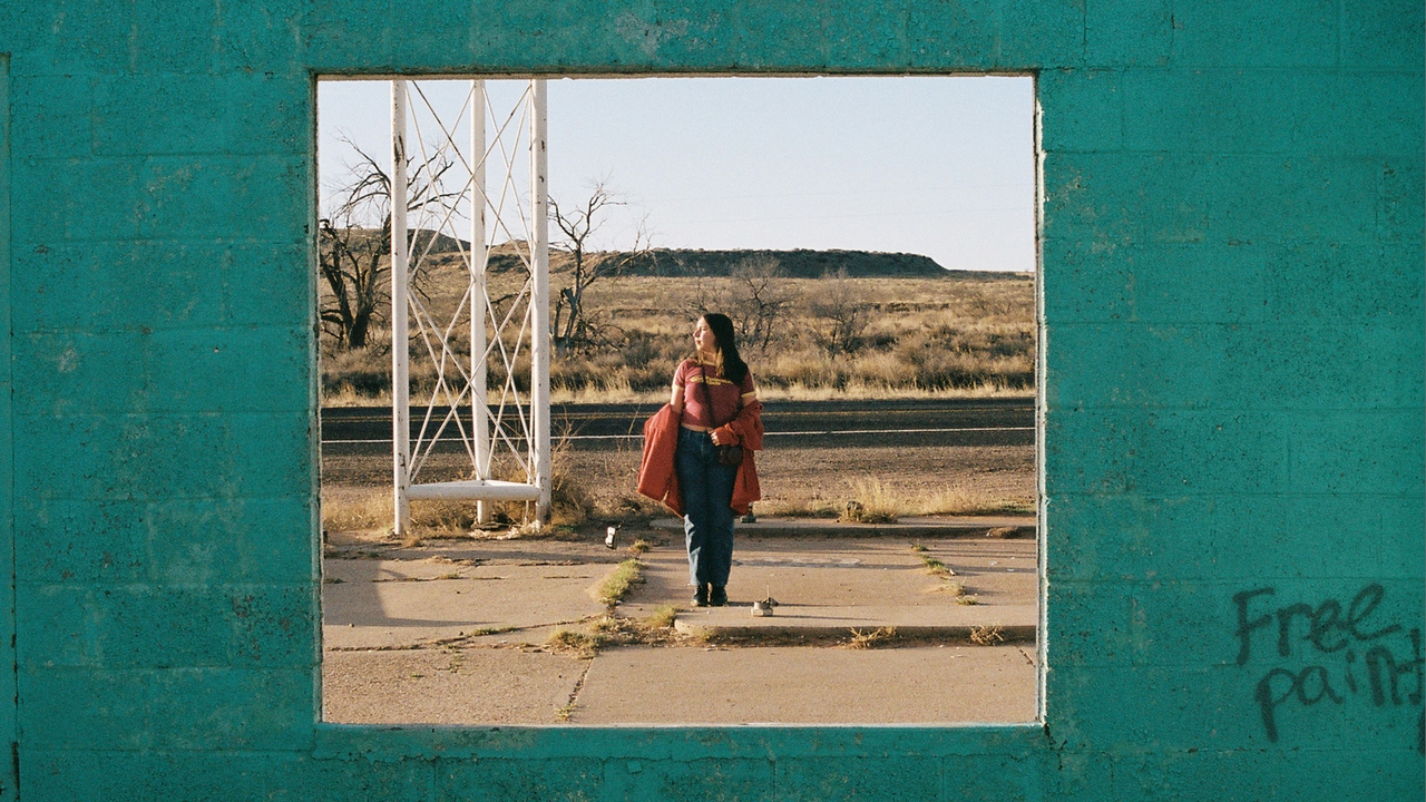 Madison Garay stand on a concrete in a New Mexico desert setting